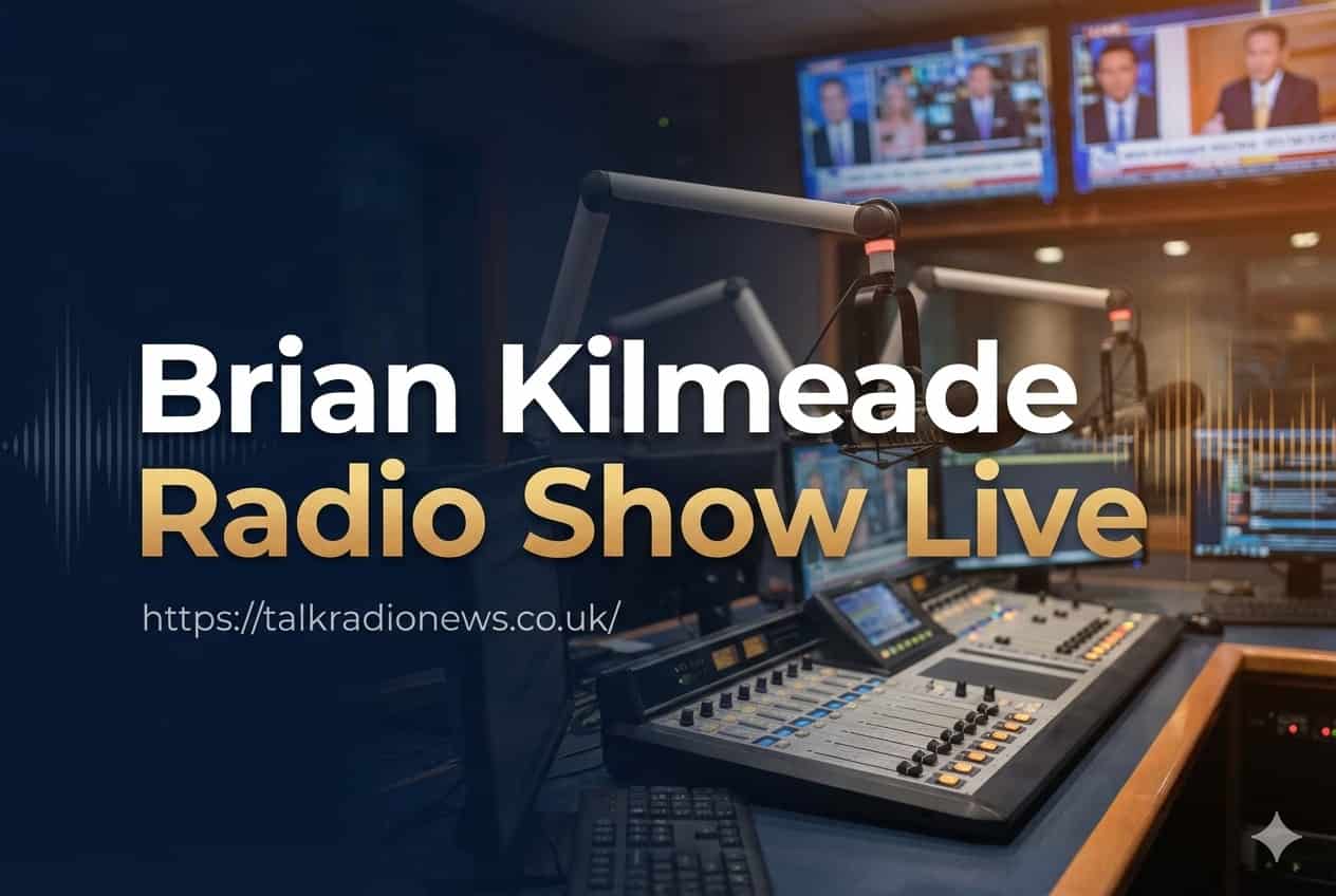  Radio host Brian Kilmeade smiling and speaking into a studio microphone during a live broadcast.