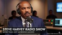 Comedian Steve Harvey smiling and speaking into a studio microphone during a broadcast of his radio show.