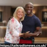 Claire Geary sports broadcaster reporting live from sideline during a game