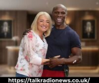 Claire Geary sports broadcaster reporting live from sideline during a game